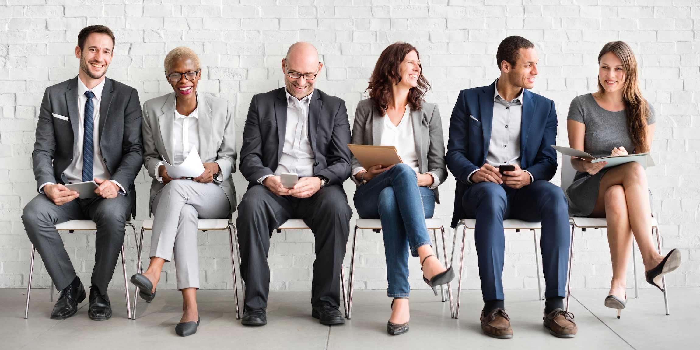 Group of diverse people are waiting for a job interview Consumer Brand Agency Partnerships: A Win-Win for Talent Acquisition