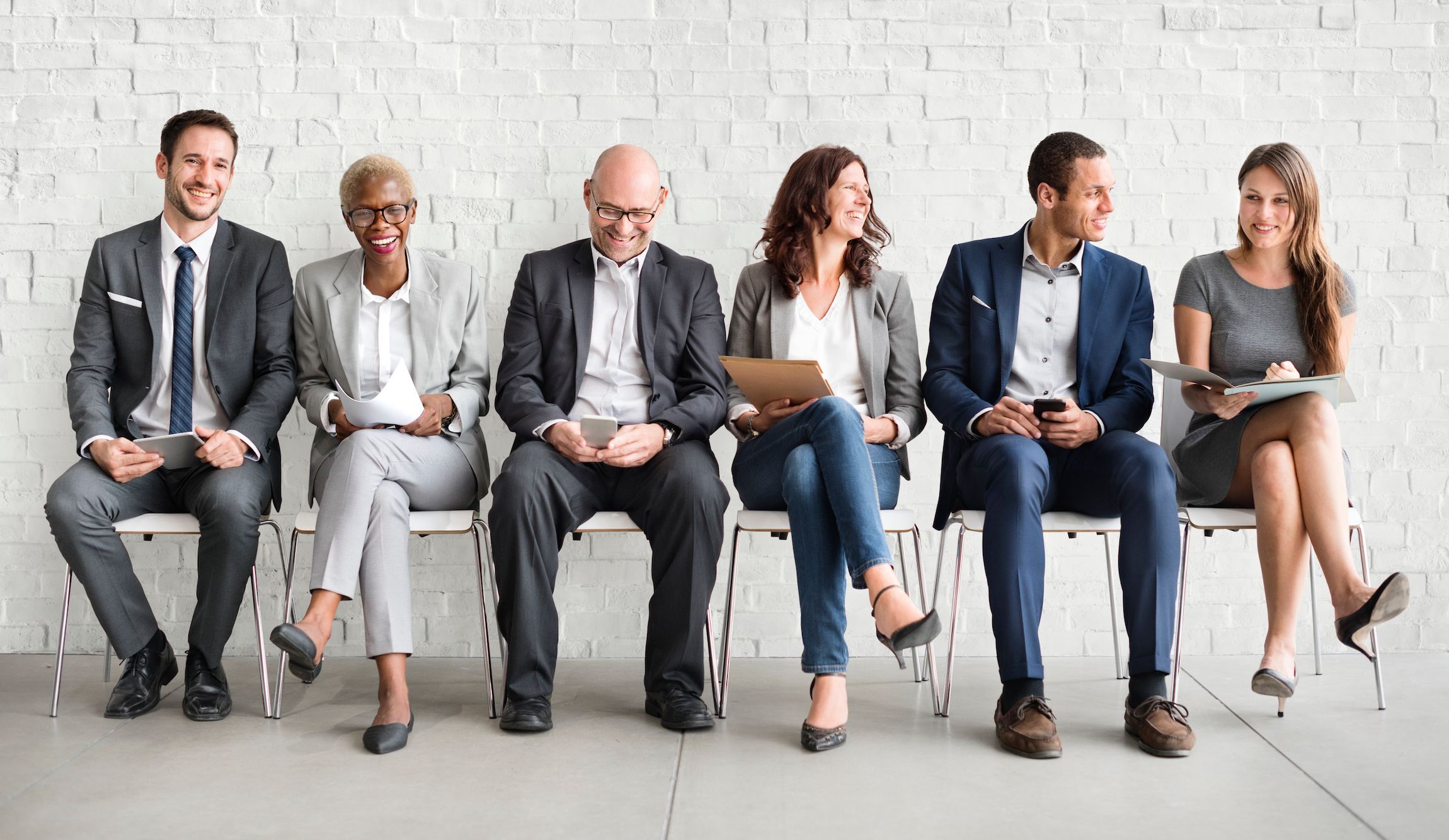 Group of diverse people are waiting for a job interview Consumer Brand Agency Partnerships: A Win-Win for Talent Acquisition