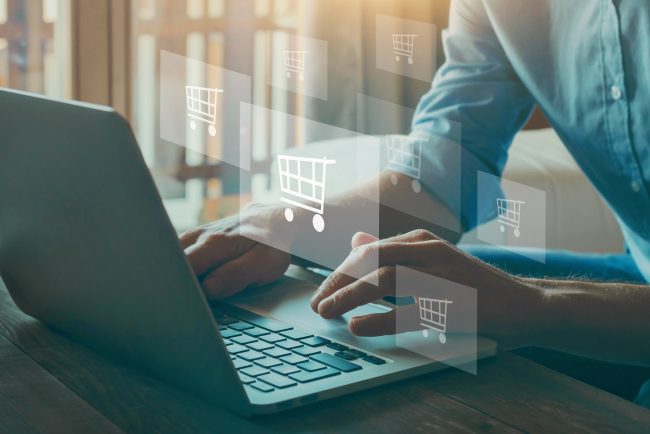 order in online store, shopping on internet, concept on virtual screen with hands typing on keyboard Unlocking Opportunities in CPG Ecommerce Careers