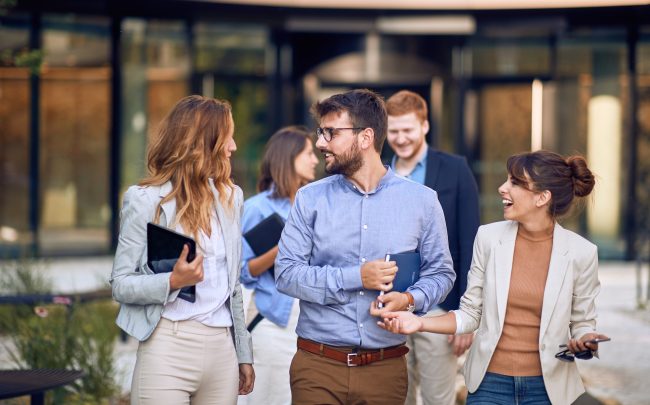 Young, urban group of bussinespeople walking Driving Growth: Key Qualities to Seek in a CPG CEO Hire