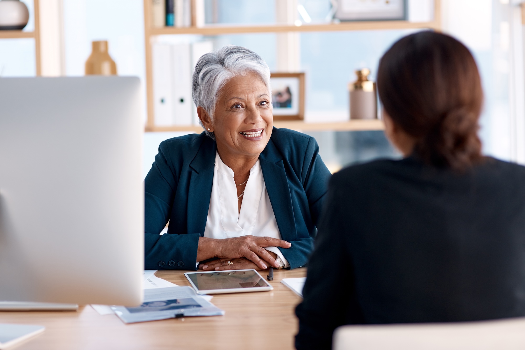 Meeting, talking or senior manager in job interview with business women in b2b negotiation discussion. Partnership collaboration, recruitment or lady speaking to hr management for hiring opportunity From Data to Strategy: The Impact of a CPG Category Manager on Brand Success